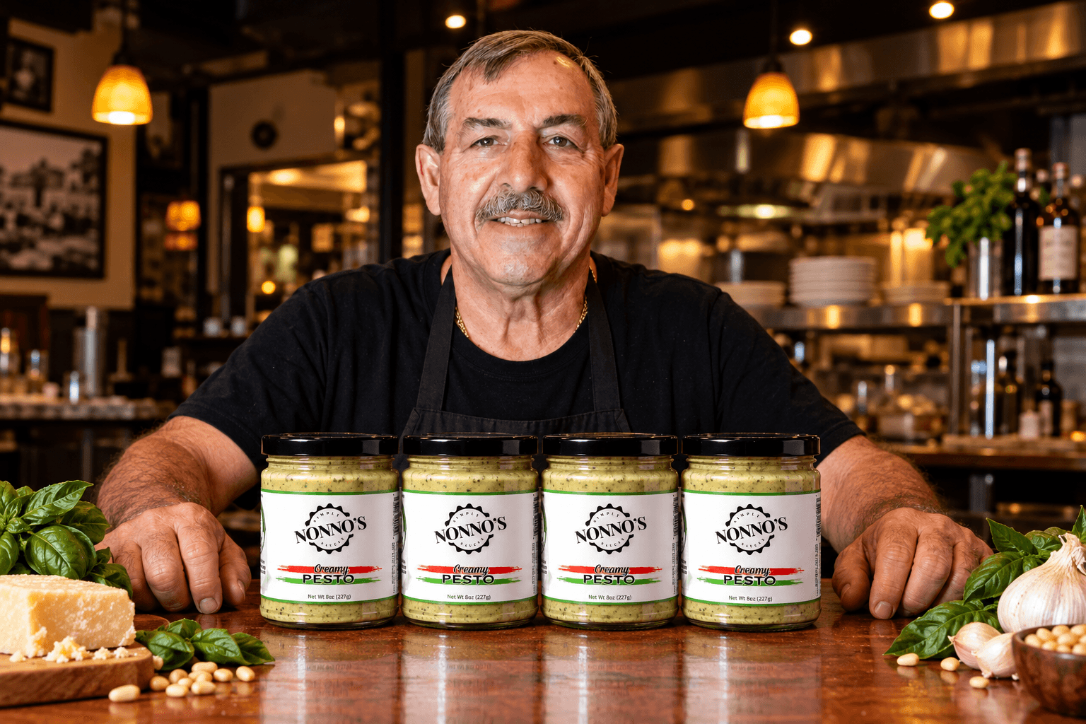 Stefano at the table with the four jars of Creamy Pesto in the Four-Jar Fix.