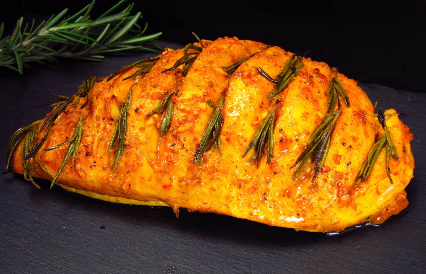 Stuffed chicken breast sliced on a plate